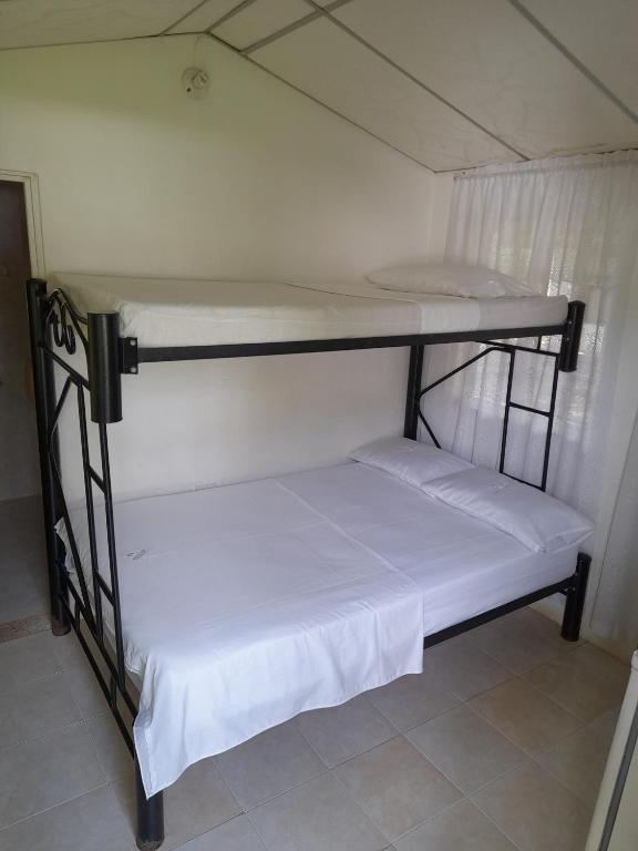 Postel nebo postele na pokoji v ubytování Hotel Campestre CENVATURS