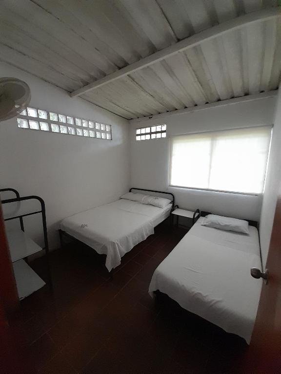 Postel nebo postele na pokoji v ubytování Hotel Campestre CENVATURS