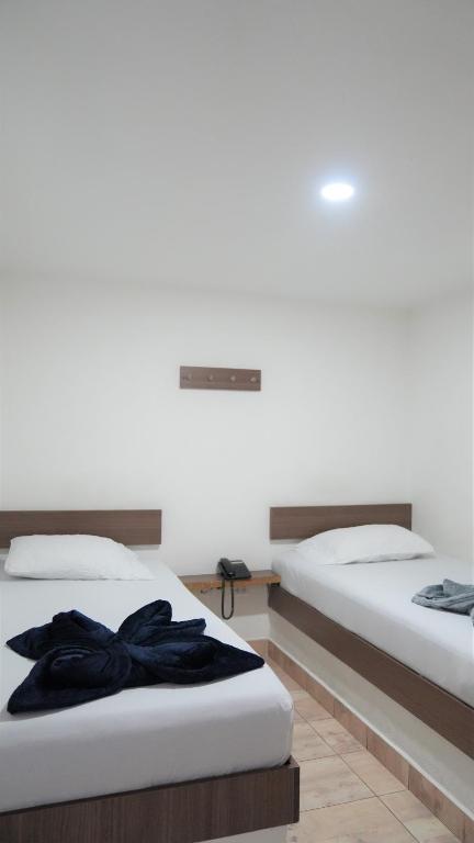 Postel nebo postele na pokoji v ubytování Hotel Salamanca Resort