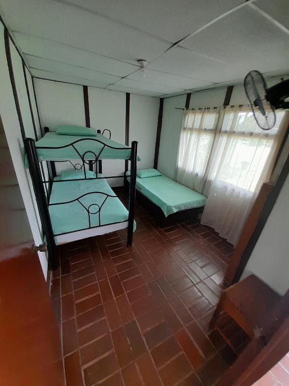 Postel nebo postele na pokoji v ubytování Hotel Campestre CENVATURS