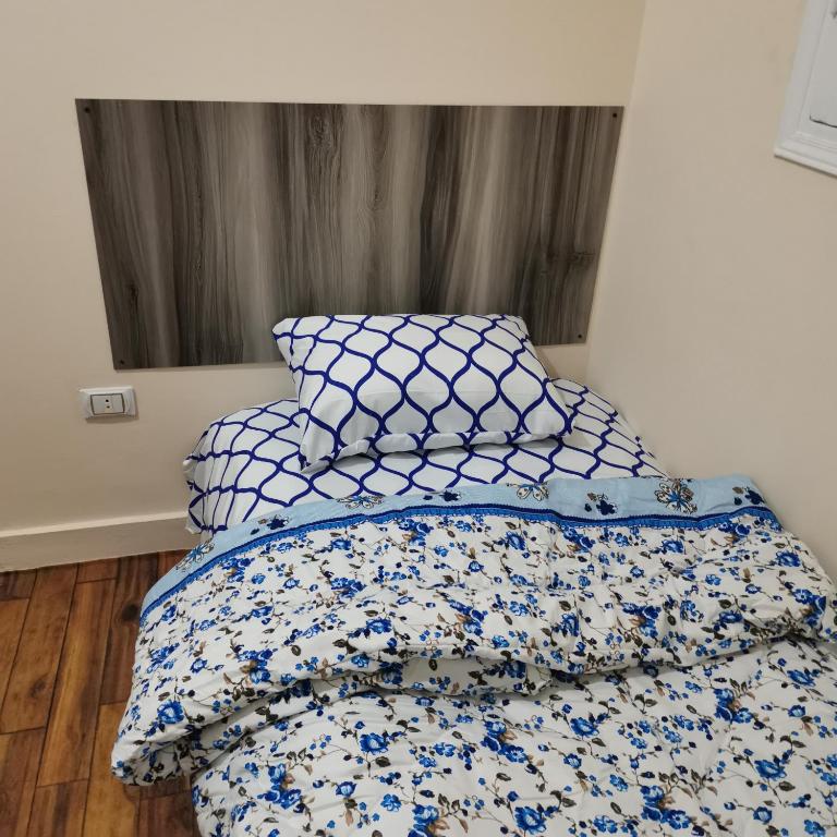 Postel nebo postele na pokoji v ubytování Economy Pyramids Inn