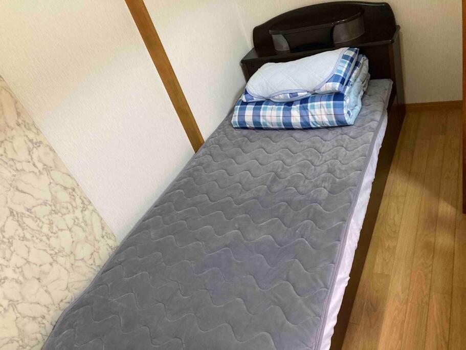 Postel nebo postele na pokoji v ubytování 手ぶらBBQ 京成佐倉駅徒歩4分 貸切宿泊　3LDK80平米以上　成田空港近い　駐車場４台(無料)