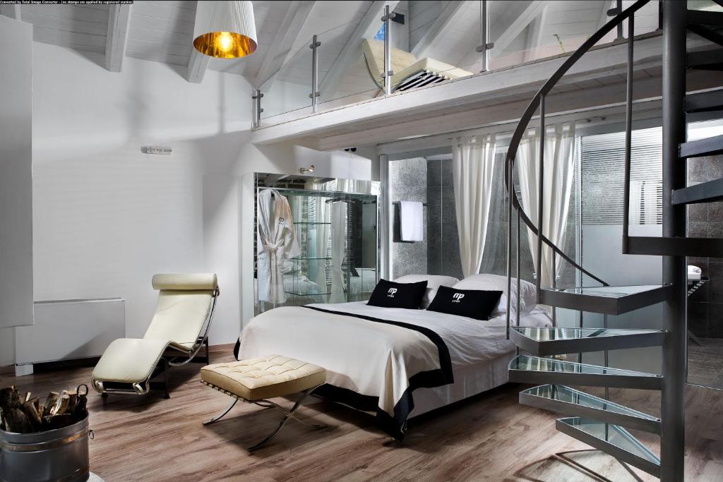 Postel nebo postele na pokoji v ubytování Mikro Papigo 1700 Hotel & Spa