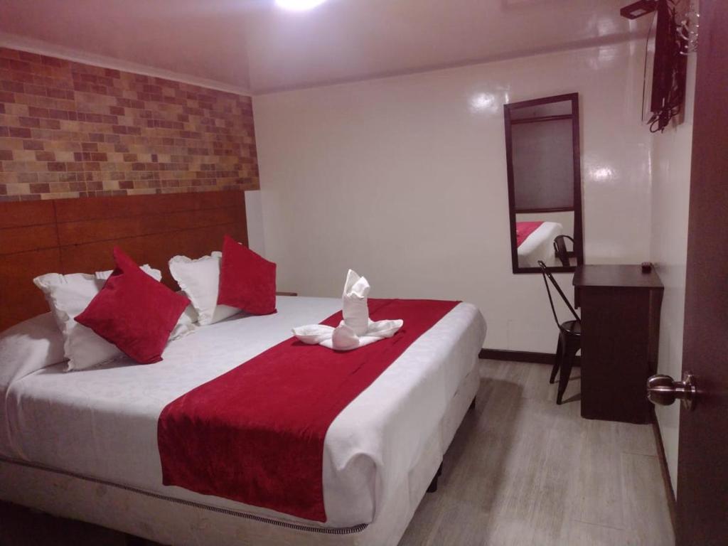 Postel nebo postele na pokoji v ubytování Hotel Casa Lamay