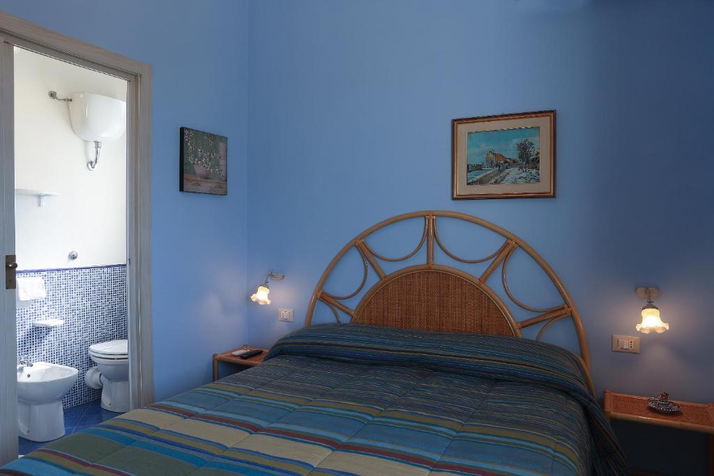 Postel nebo postele na pokoji v ubytování Villa dei giardini
