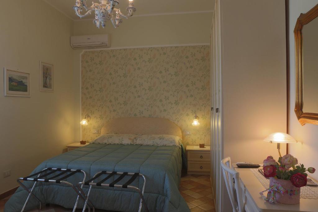 Postel nebo postele na pokoji v ubytování Villa dei giardini
