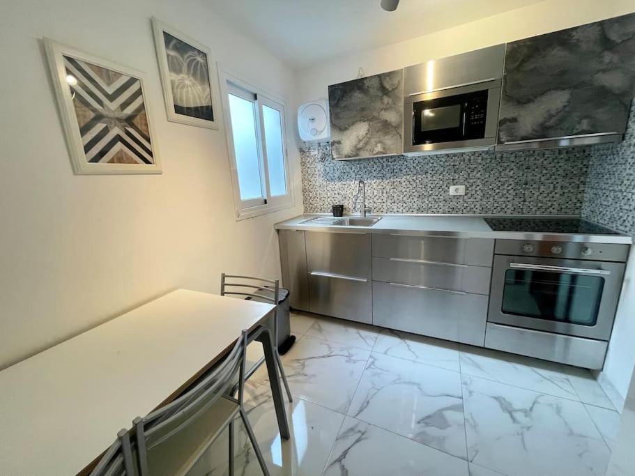 A kitchen or kitchenette at New big flat with balcony 50mts away from beach Parking Optional