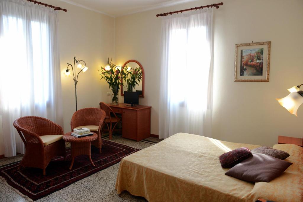 Postel nebo postele na pokoji v ubytování Hotel Villa Orio & Beatrice