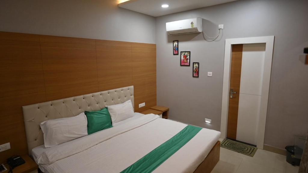 Postel nebo postele na pokoji v ubytování Hotel Green Apple