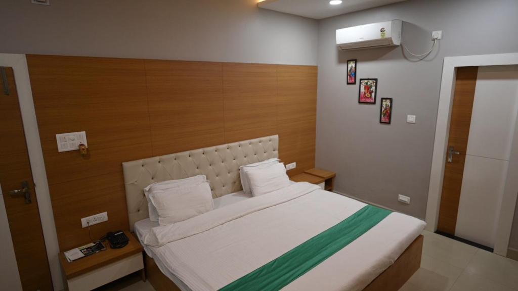 Postel nebo postele na pokoji v ubytování Hotel Green Apple
