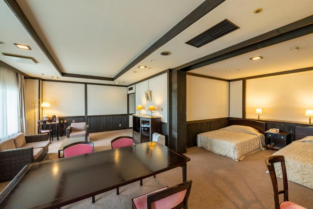 Postel nebo postele na pokoji v ubytování Isawa Tokiwa Hotel