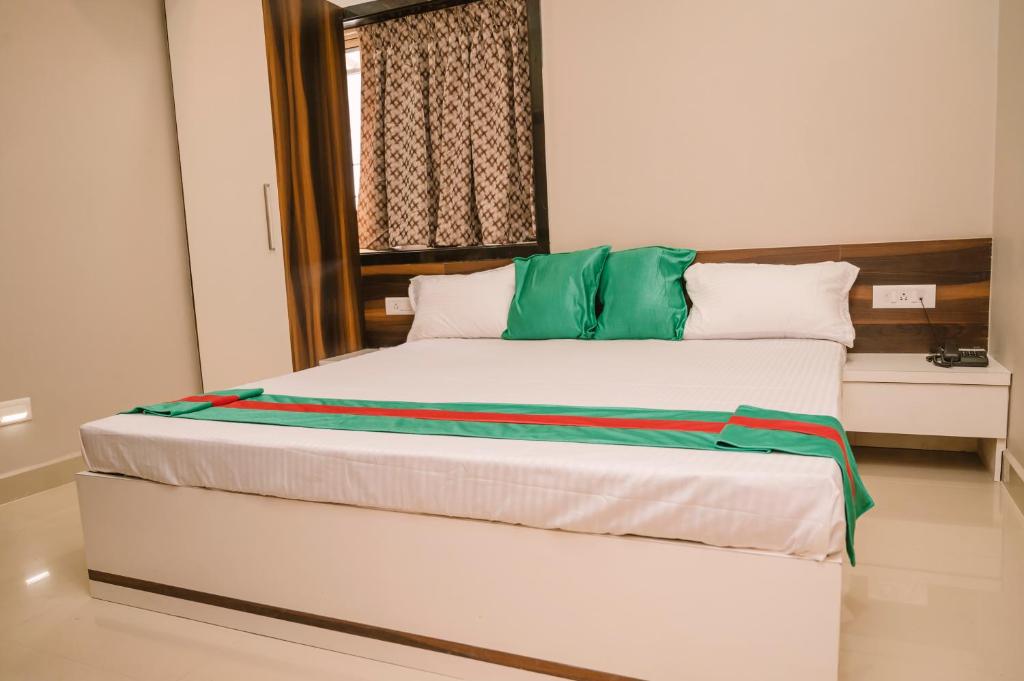 Postel nebo postele na pokoji v ubytování Hotel Green Apple