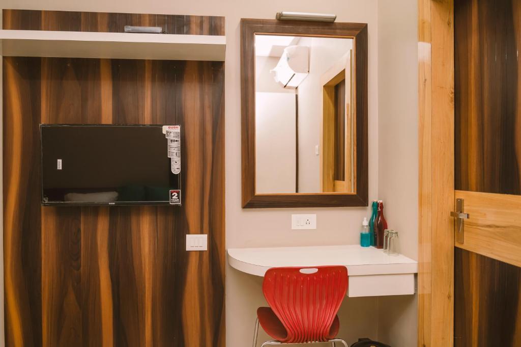 TV a/nebo společenská místnost v ubytování Hotel Green Apple