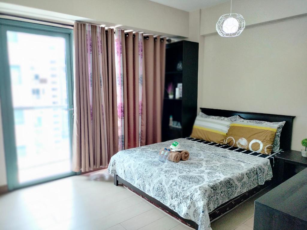 RQUI CONDOTEL NEAR AIRPORT at TWO PALMTREE VILLAS