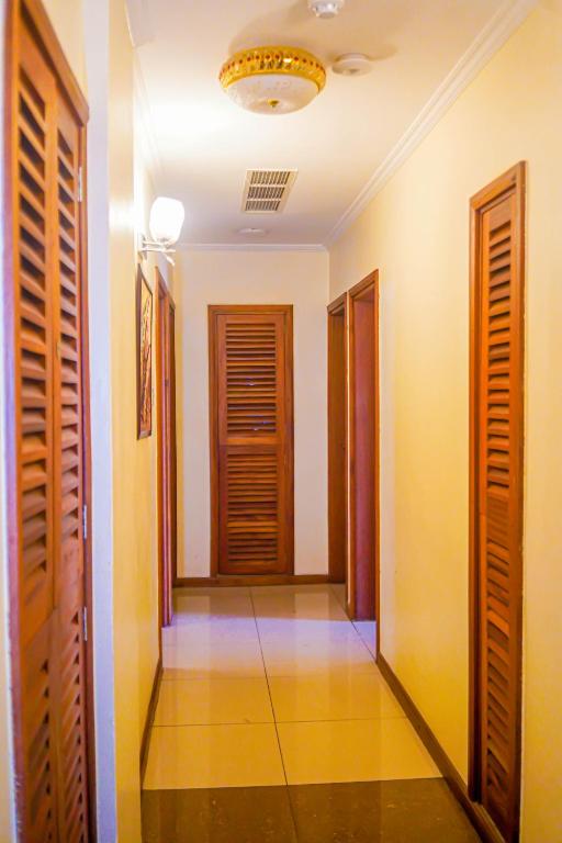 a hallway with wooden doors and a hallwayngth at After 40 Hotel in Nairobi