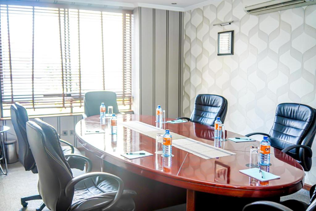 a meeting room with a large table and chairs at After 40 Hotel in Nairobi
