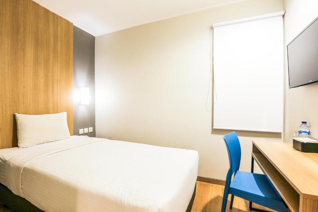 Postel nebo postele na pokoji v ubytování Hotel Citradream Bandung