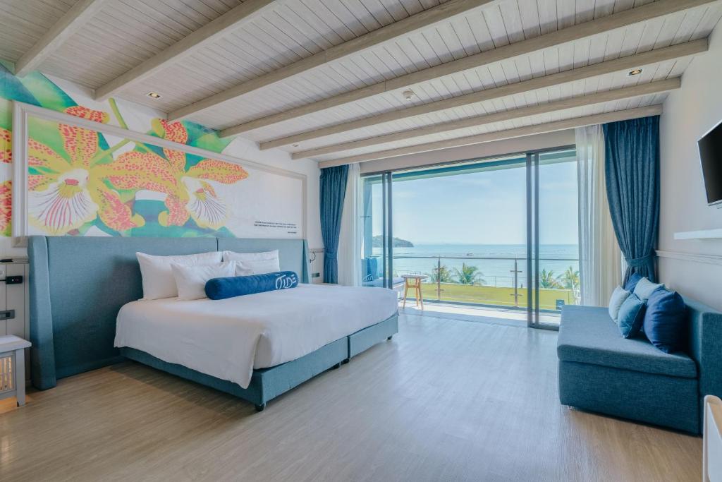 Postel nebo postele na pokoji v ubytování Hotel Tide Phuket Beachfront