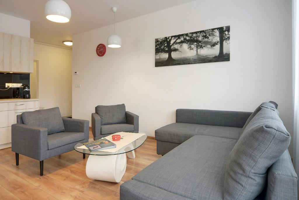 Posezení v ubytování Stonowane i Eleganckie Apartamenty Sun Seasons 24 w Świeradowie Zdroju by Noclegi Renters