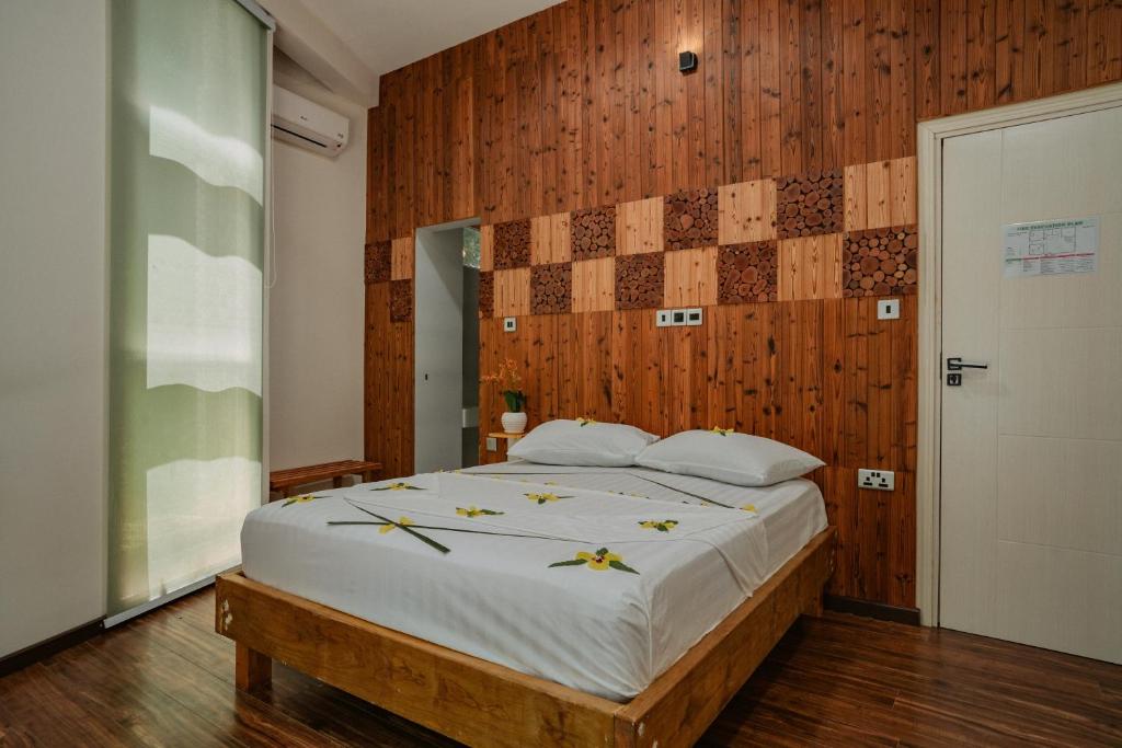 Postel nebo postele na pokoji v ubytování Finolhu Beach Guest House