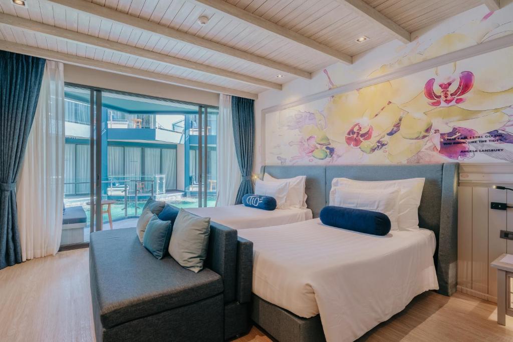 Postel nebo postele na pokoji v ubytování Hotel Tide Phuket Beachfront