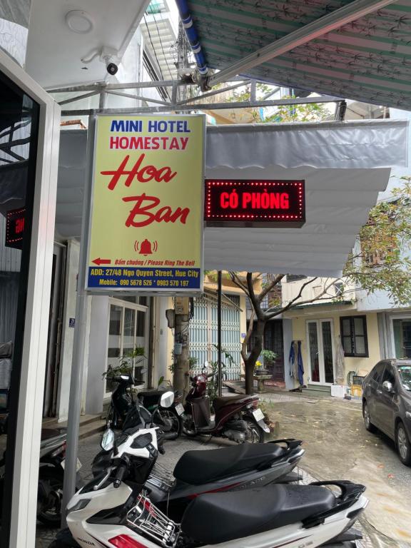 a group of motorcycles parked in front of a building at Hoa ban Homestay in Hue