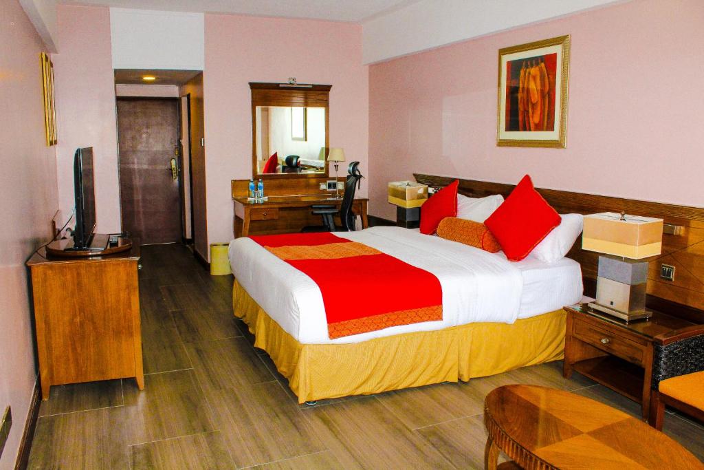 Postel nebo postele na pokoji v ubytování Merica Hotel