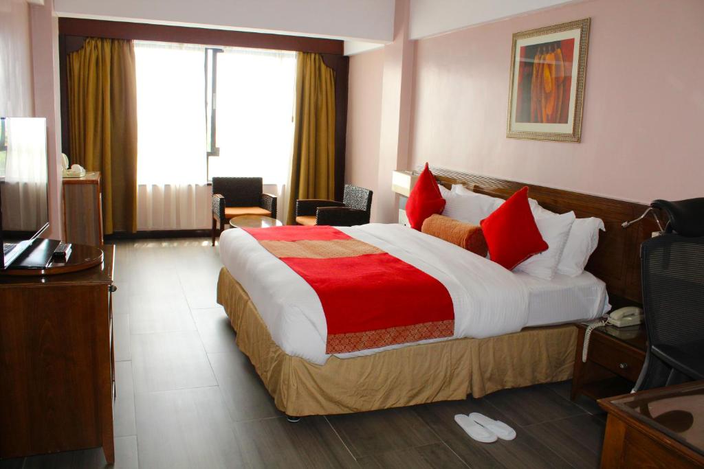 Postel nebo postele na pokoji v ubytování Merica Hotel