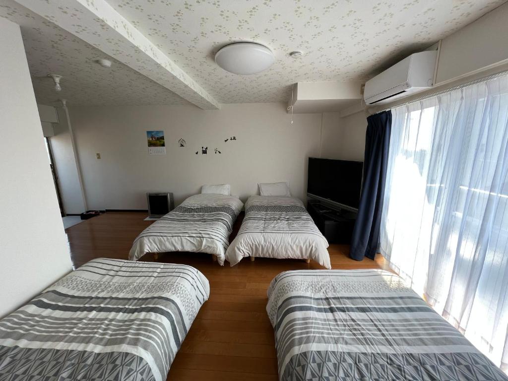長楽園 - Chambre Quadruple Avec Salle De Bain