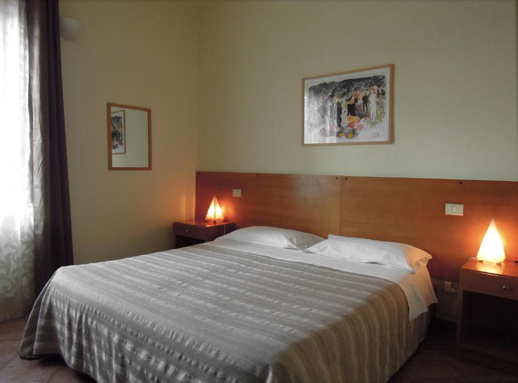 Postel nebo postele na pokoji v ubytování Il Vecchio Mulino