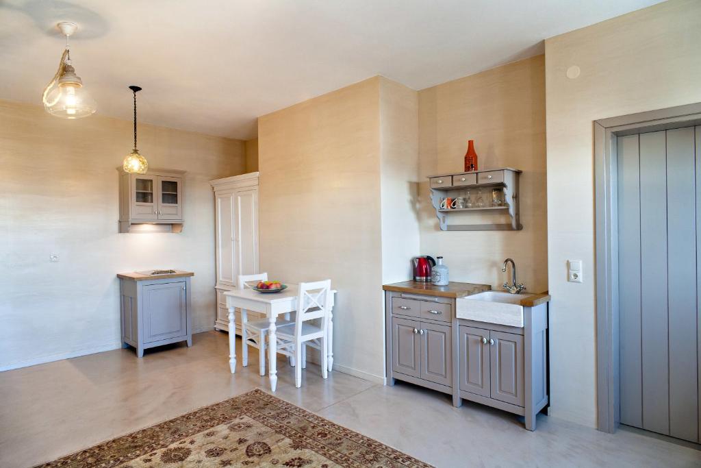 A kitchen or kitchenette at Haones Suites
