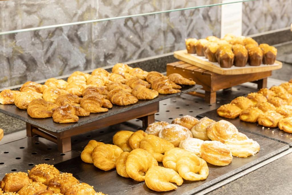 a bunch of donuts and other pastries on display at Ilunion Calas de Conil in Conil de la Frontera