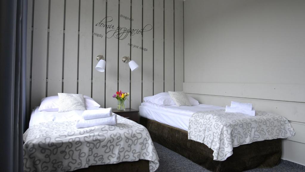 Posteľ alebo postele v izbe v ubytovaní Hotel Otomin
