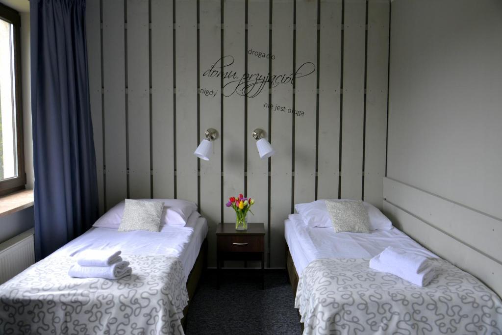 Posteľ alebo postele v izbe v ubytovaní Hotel Otomin
