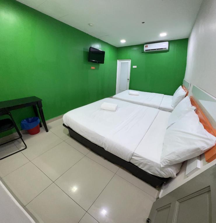 Postel nebo postele na pokoji v ubytování Red Orange Hotel Klang - 5 min to Klang Town