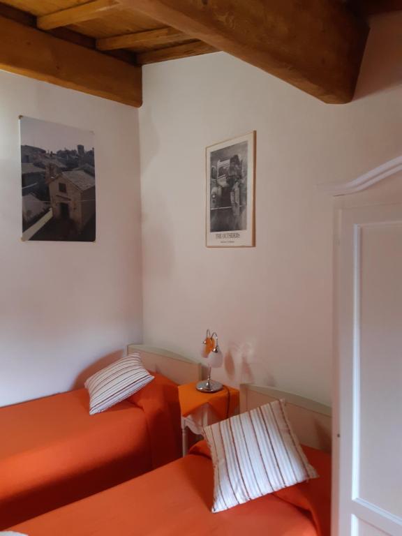 Letto o letti in una camera di B&B Il Grifo
