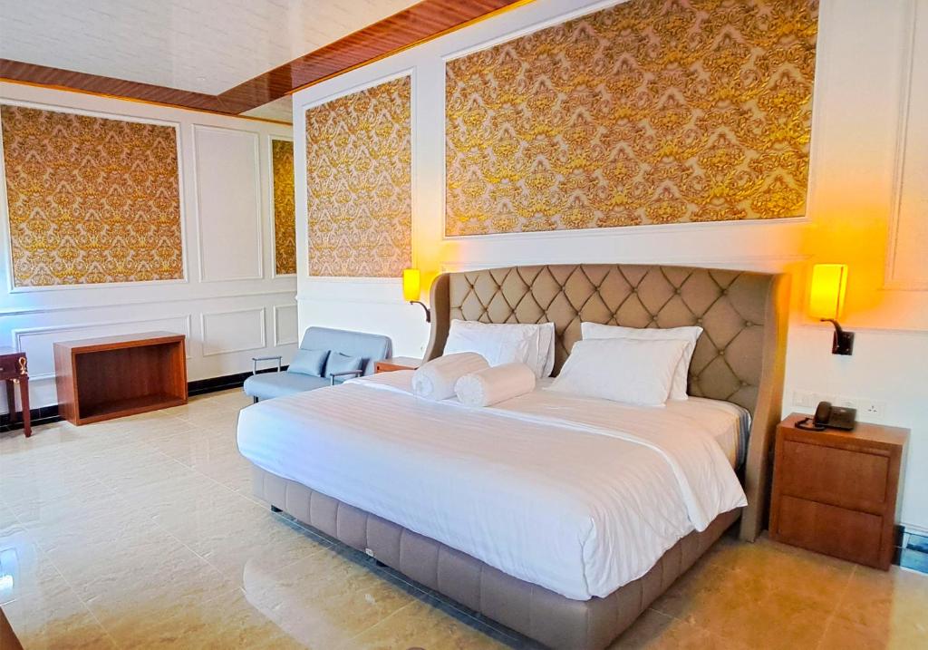 Postel nebo postele na pokoji v ubytování Gili Beachfront Suites