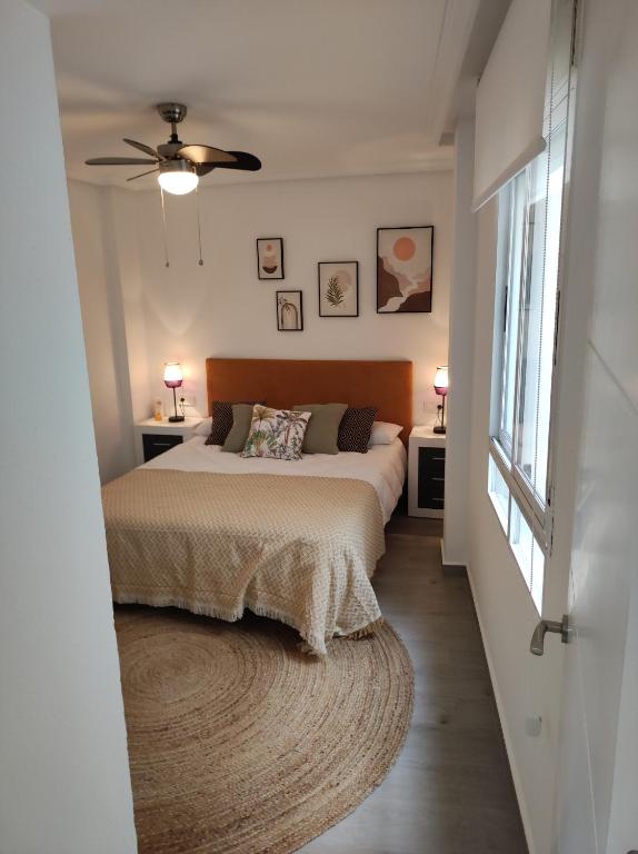 A bed or beds in a room at Apartamento Torre Buena Vista