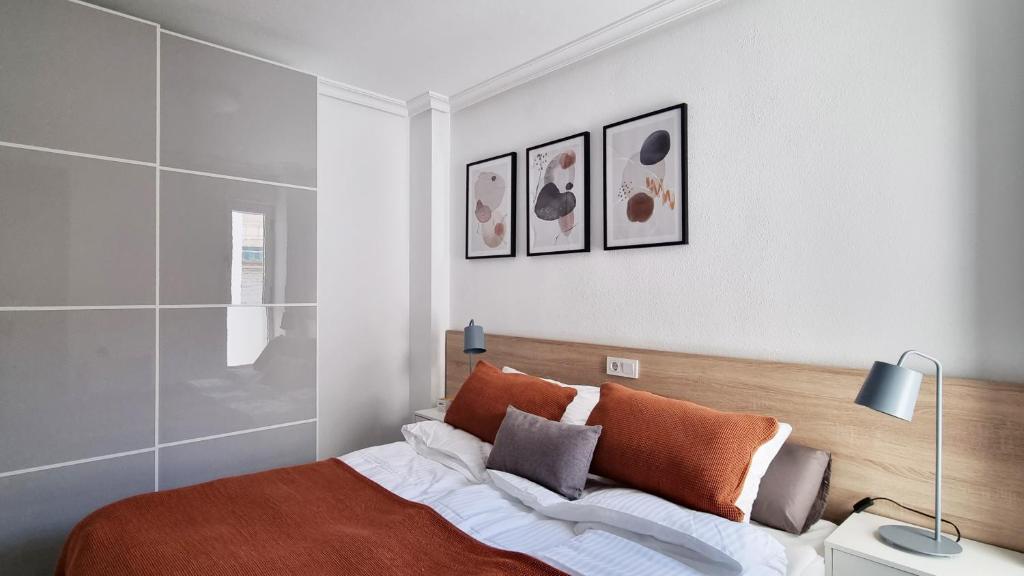 A bed or beds in a room at Apartamento Torre Buena Vista