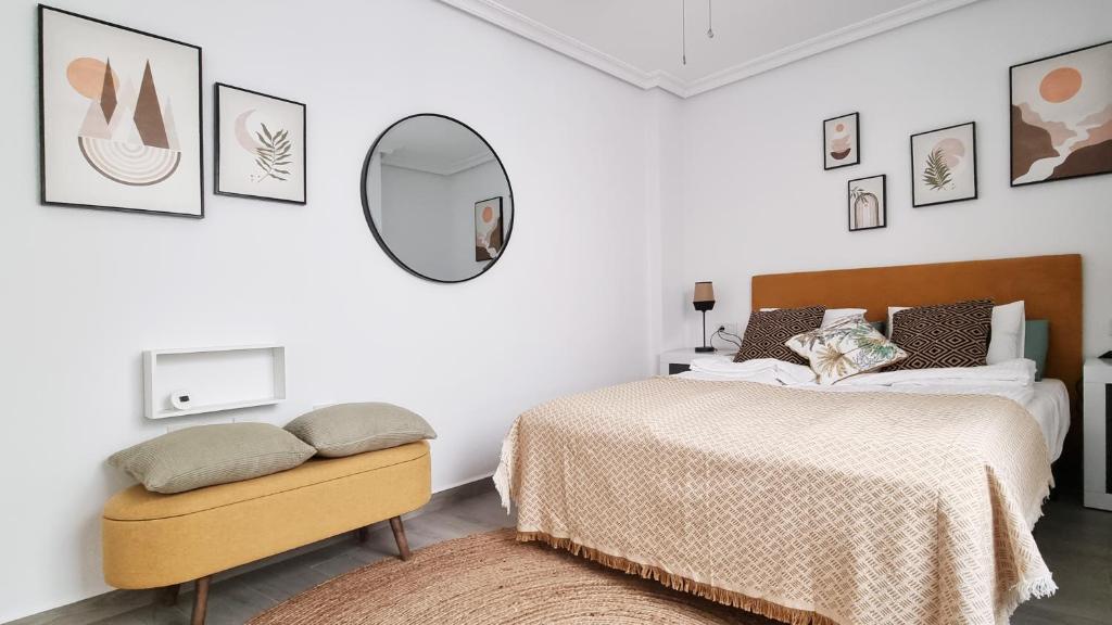 A bed or beds in a room at Apartamento Torre Buena Vista