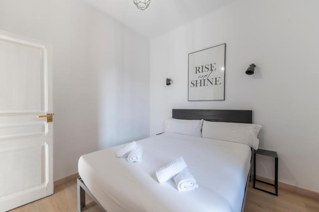 Posteľ alebo postele v izbe v ubytovaní Centric Gracia Apartments