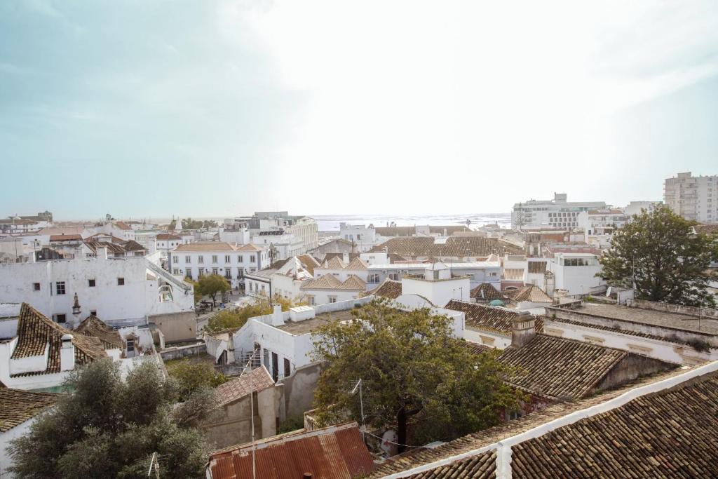 a view of a city with white buildings at Blue Sky Apartment in Faro