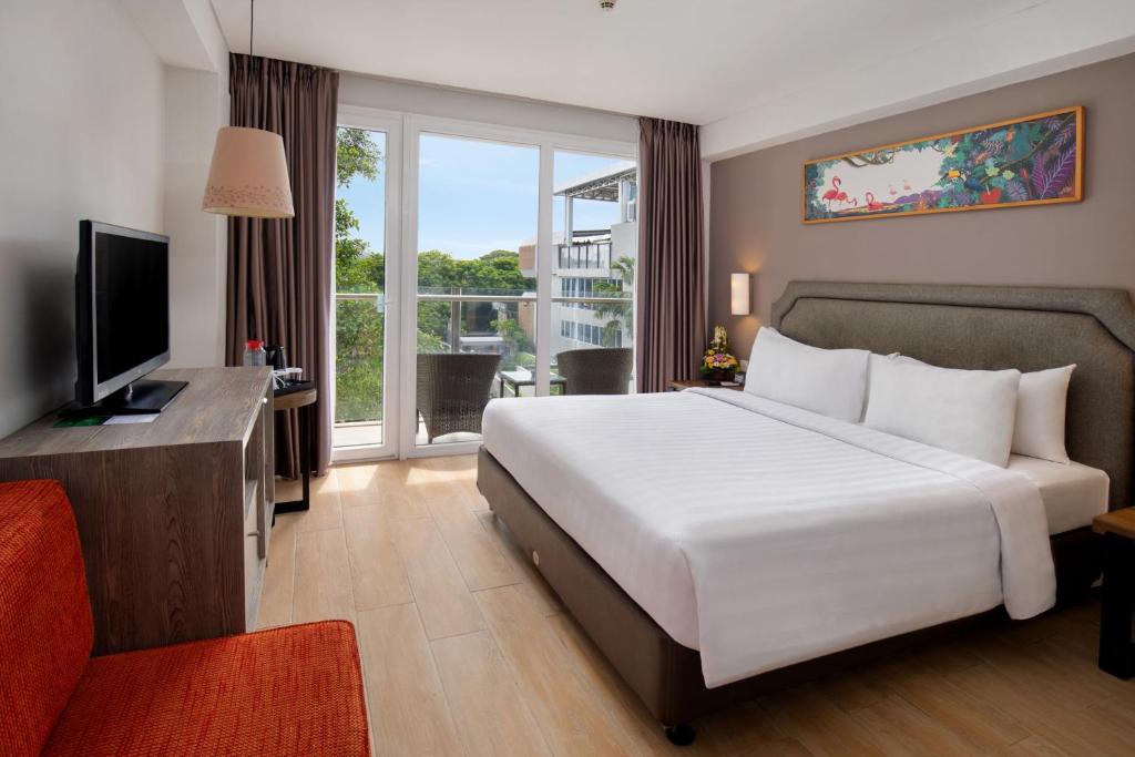 Postel nebo postele na pokoji v ubytování Harper Kuta Hotel by ASTON