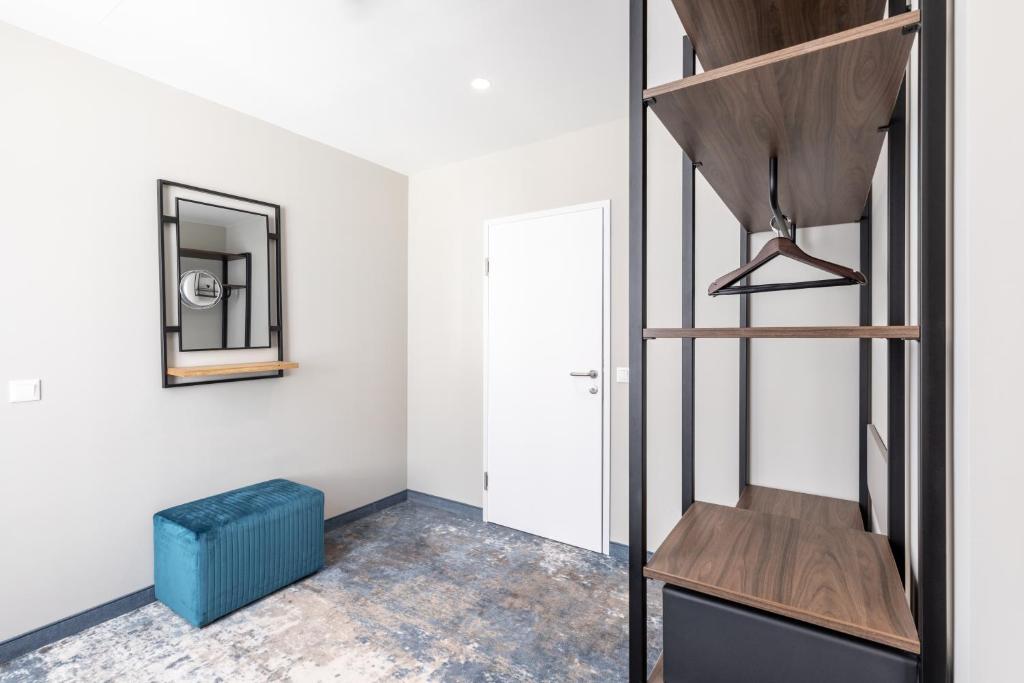 A bed or beds in a room at Garner Hotel Klagenfurt - Moser Verdino by IHG