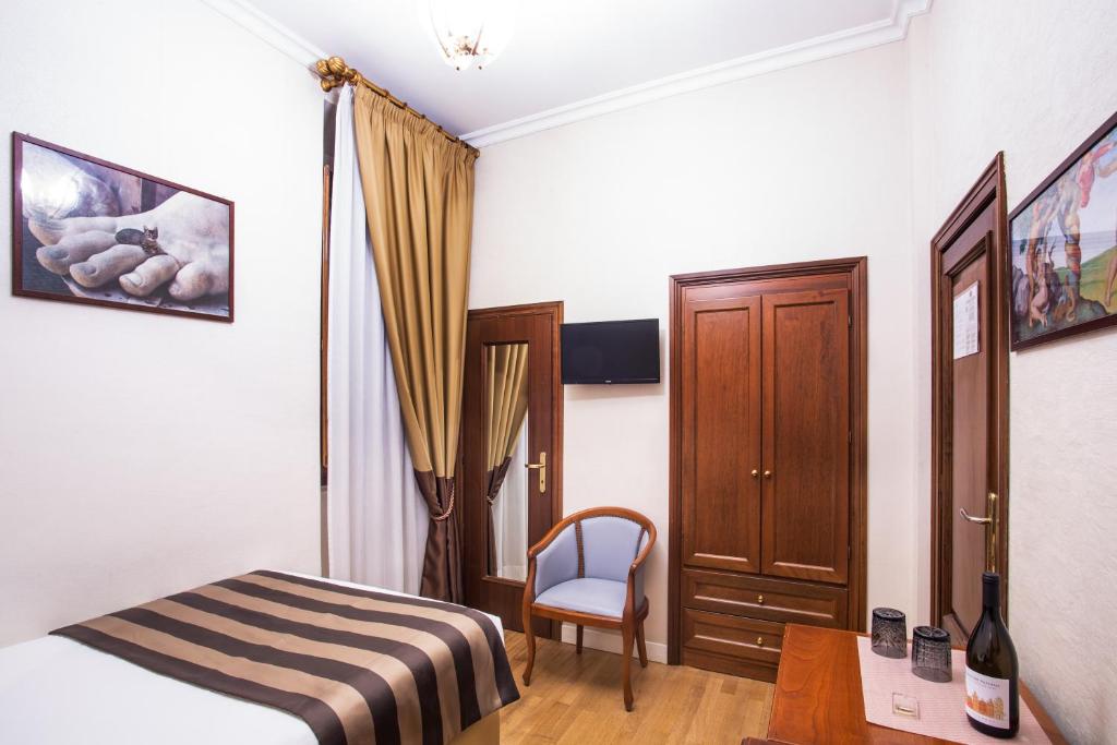 Postel nebo postele na pokoji v ubytování Hotel Piazza Di Spagna