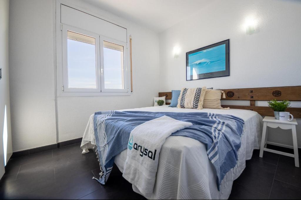 Postel nebo postele na pokoji v ubytování Apartamento Rodas Arysal