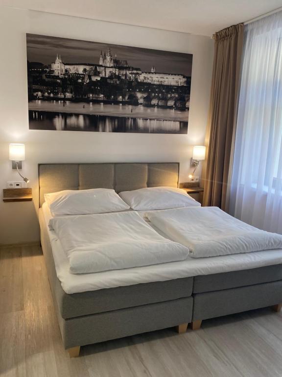 Postel nebo postele na pokoji v ubytování Adeba Plus
