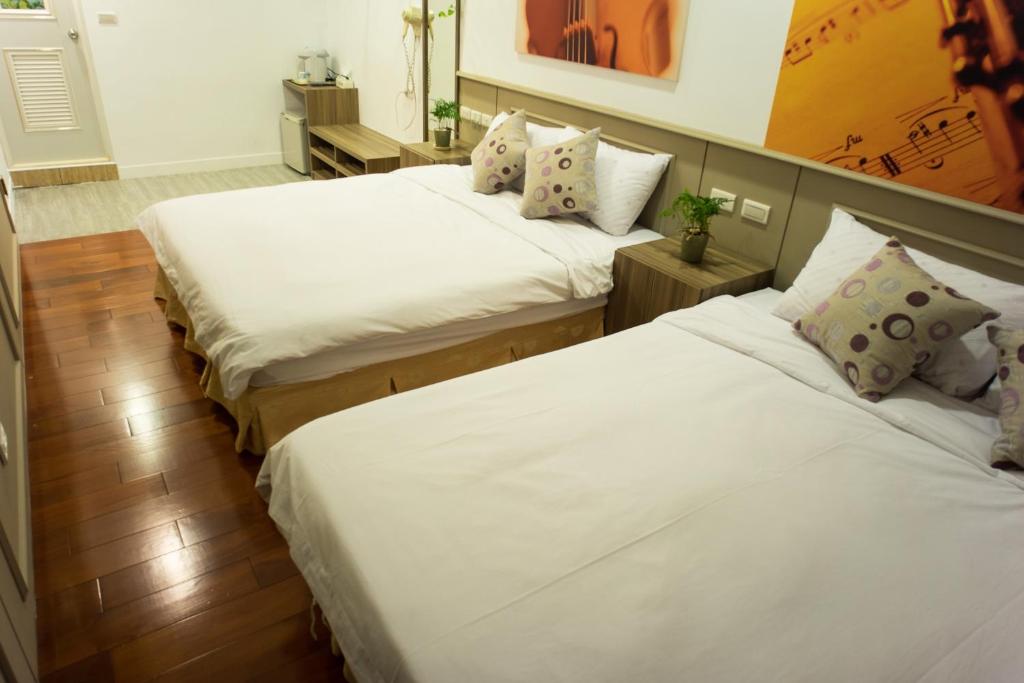 Postel nebo postele na pokoji v ubytování Bei Pin B&B