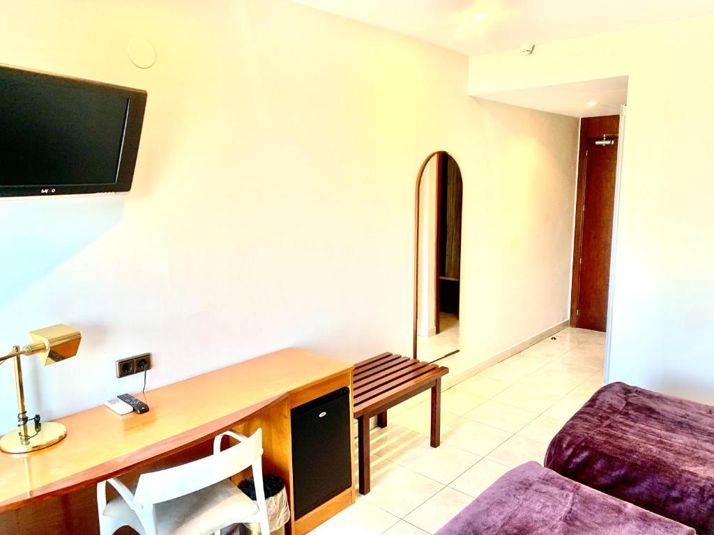 TV a/nebo společenská místnost v ubytování Hotel Arumí