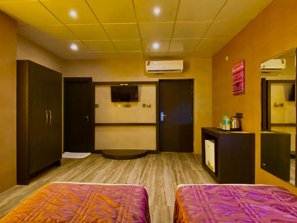 Postel nebo postele na pokoji v ubytování Ace Prime Hotel